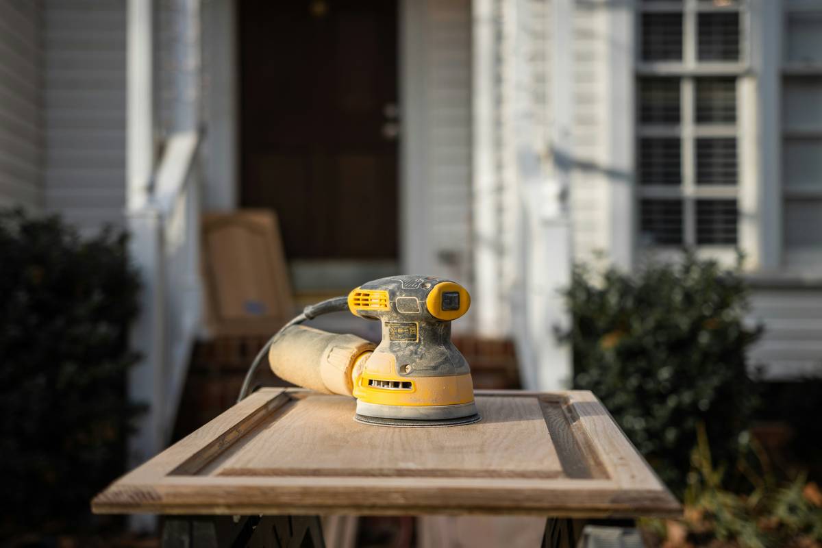 Small handheld router tool routing a clean edge on hardwood